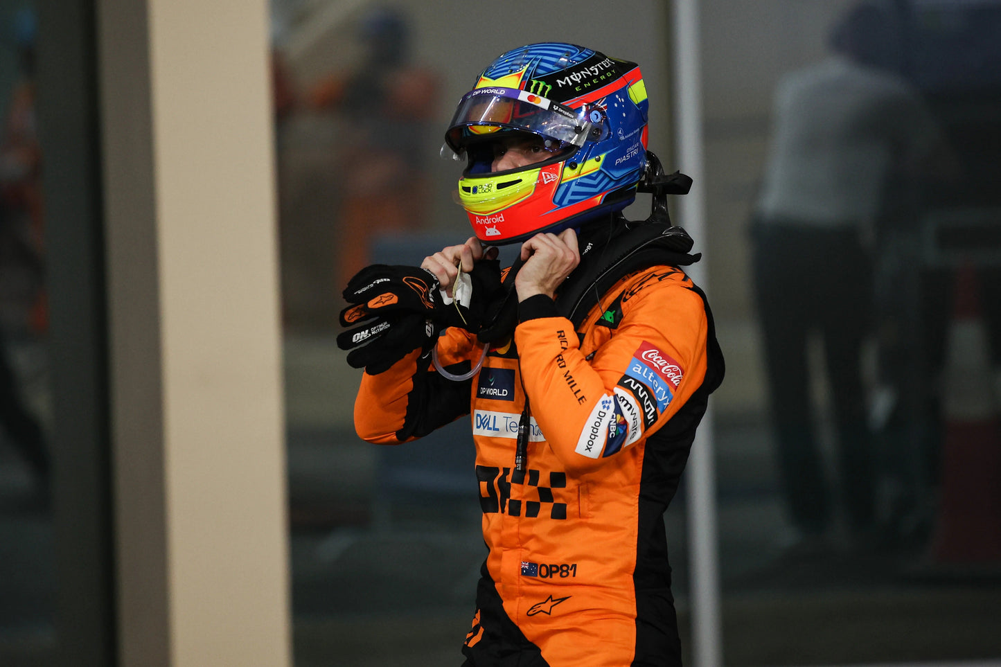 Black Oscar Piastri 2024 McLaren F1 Race Gloves laid flat, front view, showing the full racing design and replica stitching