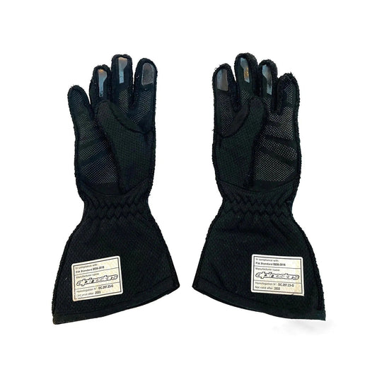 Pair of black Oscar Piastri 2025 Replica Race Gloves F1 McLaren with text labels front view