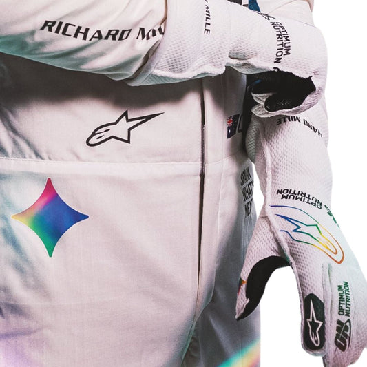 oscar-piastri in a white racing suit with colorful sponsor logos, shown against a plain white background right view