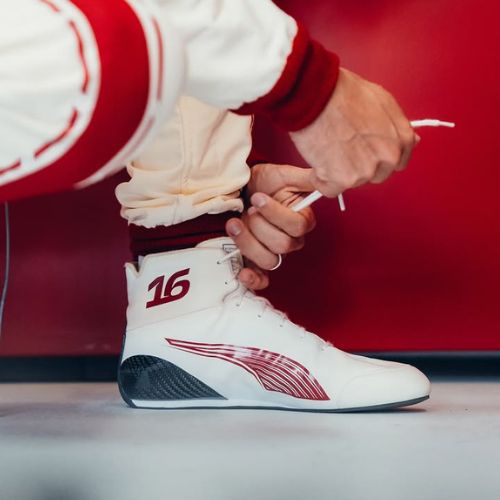 Low-profile racing shoe with mesh upper and thin sole