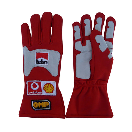 Red Michael Schumacher 2006 Ferrari F1 Race Gloves laid flat, front view, showing the full racing design and replica stitching