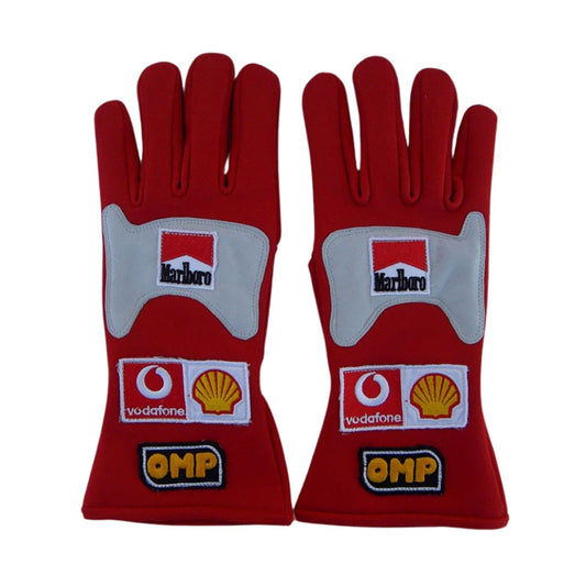 Red Michael Schumacher 2006 Ferrari F1 Race Gloves laid flat, front view, showing the full racing design and replica stitching