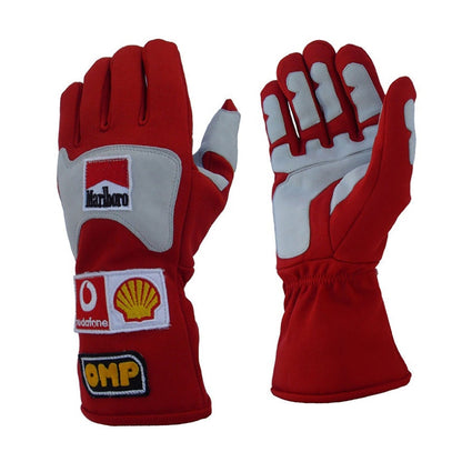 Red Michael Schumacher 2006 Ferrari F1 Race Gloves laid flat, front view, showing the full racing design and replica stitching