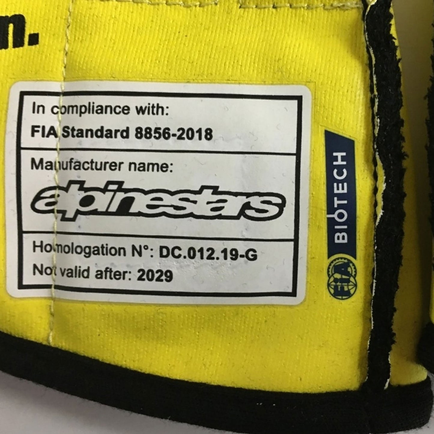 Yellow Esteban Ocon 2020 Renault F1 Race Gloves in close-up detail, showing the palm grip pattern used in GP racing conditions