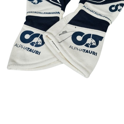 White Daniel Ricciardo 2023 AlphaTauri F1 Replica Race Gloves in close-up detail, showing the palm grip pattern used in GP racing conditions