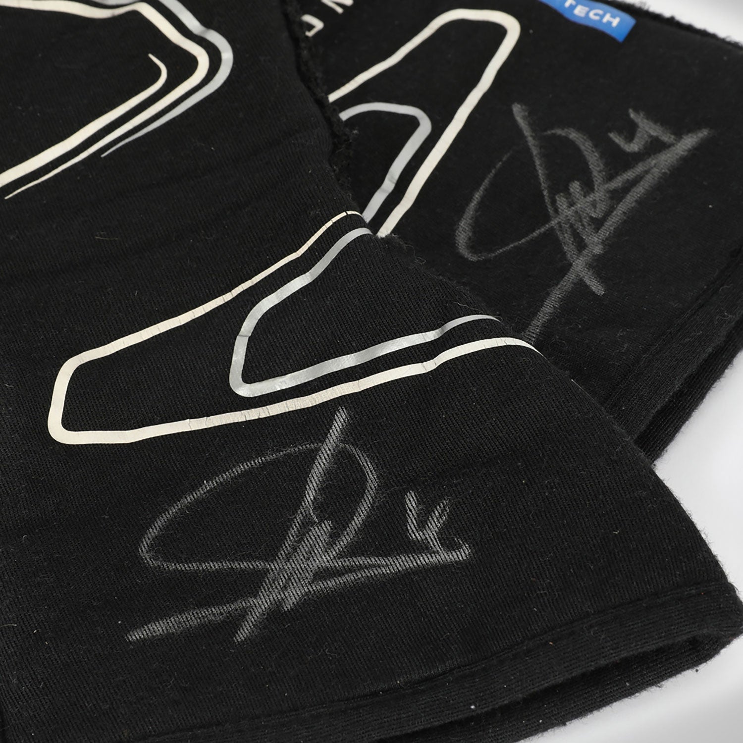 Black Lando Norris 2023 McLaren F1 Race Gloves Replica in close-up detail, showing the palm grip pattern used in GP racing conditions