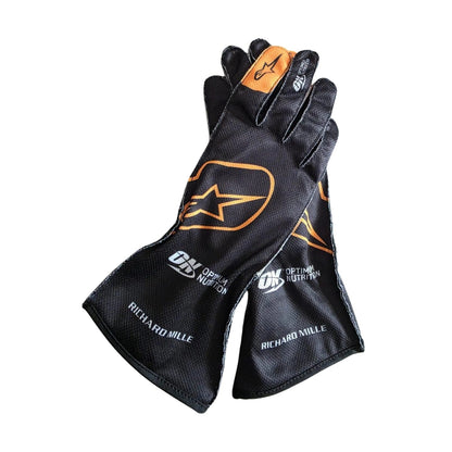 Black Lando Norris 2024 McLaren F1 Replica Race Gloves laid flat, front view, showing the full racing design and replica stitching