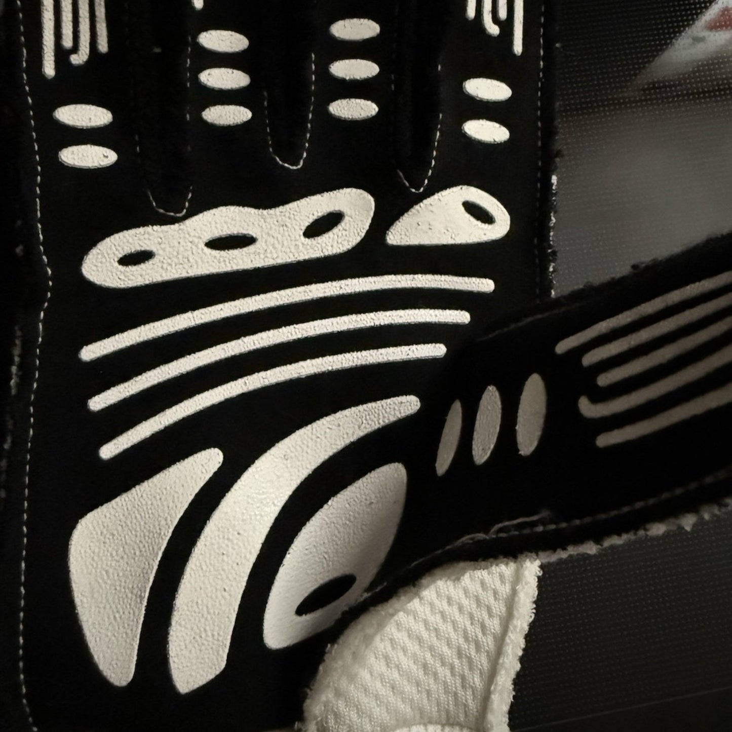 White George Russell 2024 Mercedes Qatar GP F1 Race Gloves in close-up detail, showing the palm grip pattern used in GP racing conditions
