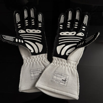 White George Russell 2024 Mercedes Qatar GP F1 Race Gloves shown side-on, highlighting the wrist strap and grip texture for grand prix use