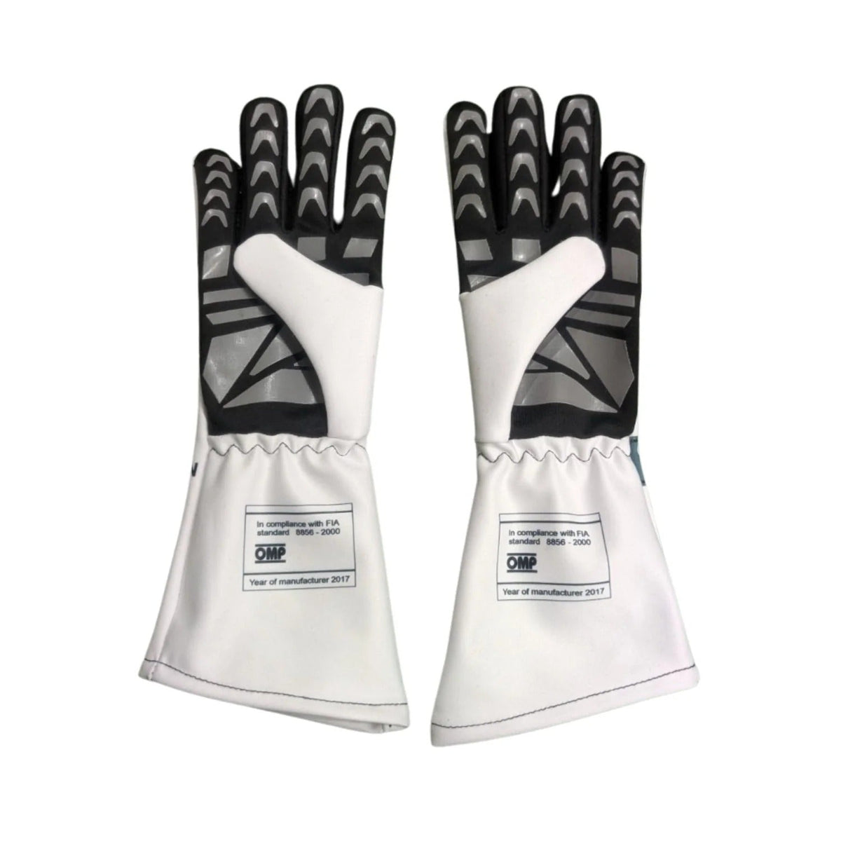 A pair of white and black 2025 Brad Pitt ( Damson Idris) The Movie Racing Gloves Team F1 APXGP with textured black backs and white cuffs, displayed against a plain white background.