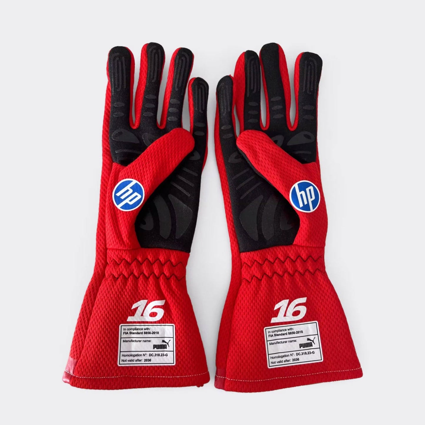 Red Charles Leclerc 2026 Ferrari F1 Race Gloves Replica shown side-on, highlighting the wrist strap and grip texture for grand prix use