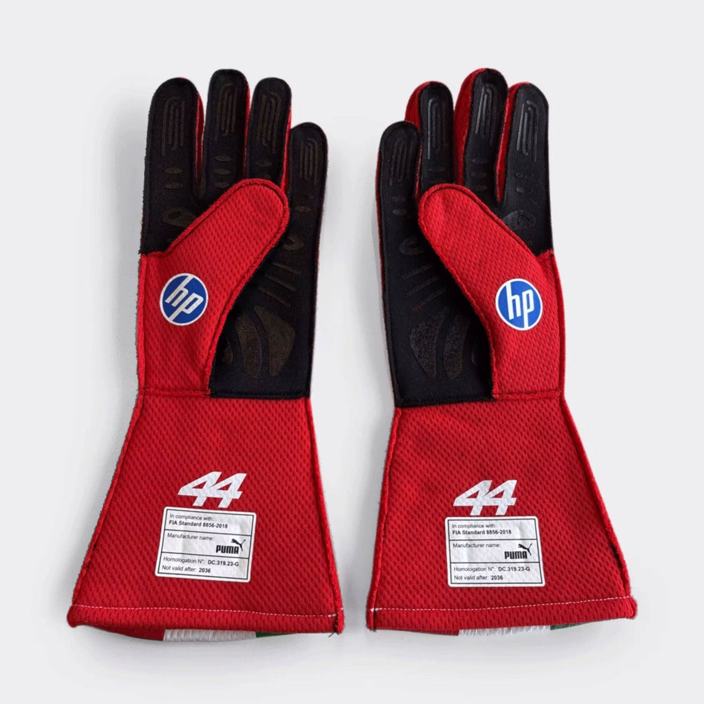 Red Lewis Hamilton 2026 Ferrari F1 Replica Race Gloves shown side-on, highlighting the wrist strap and grip texture for grand prix use