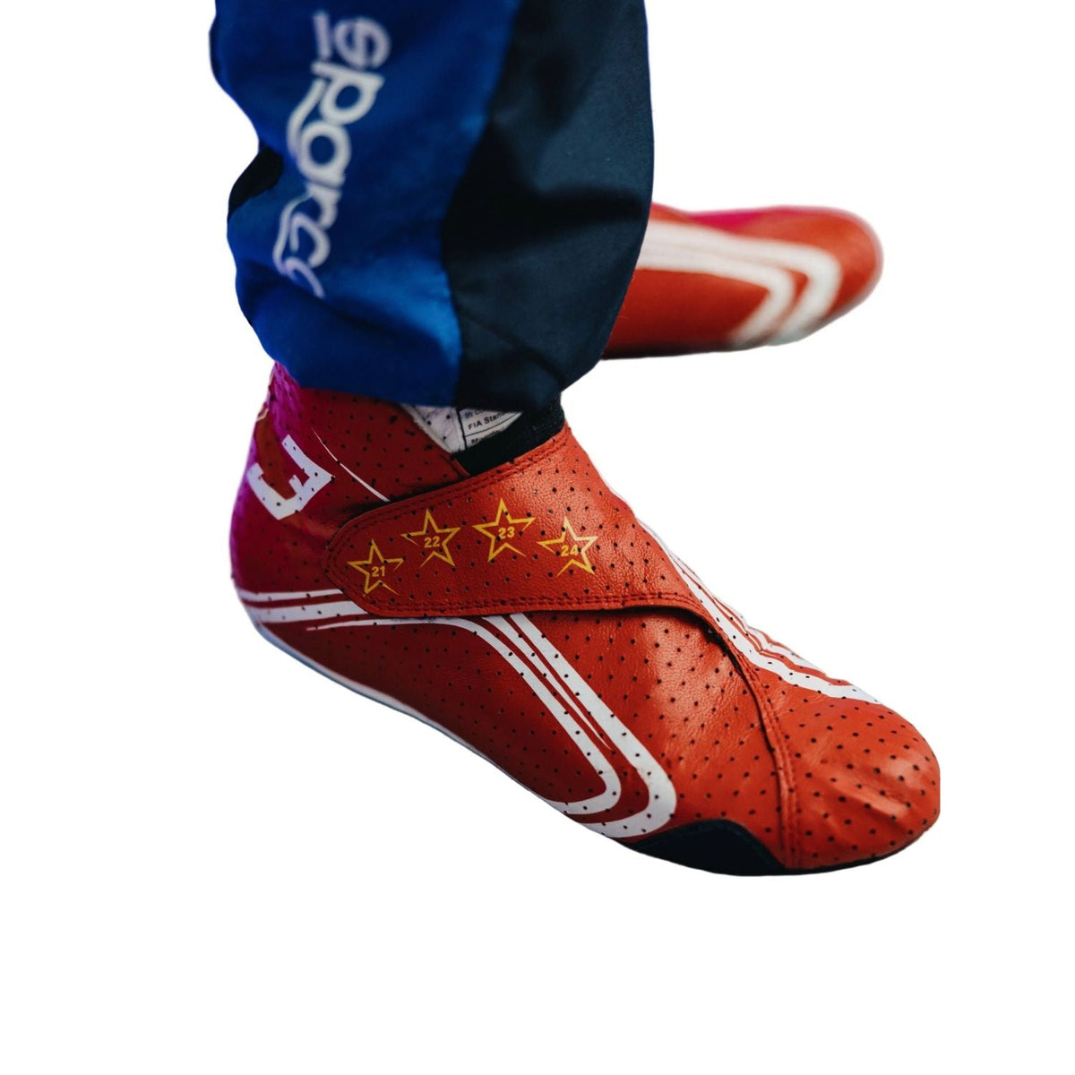 red racing shoes for Max Verstappen supporters, with logo-style graphics across the upper. Everyday racing attire for fans who never switch off.