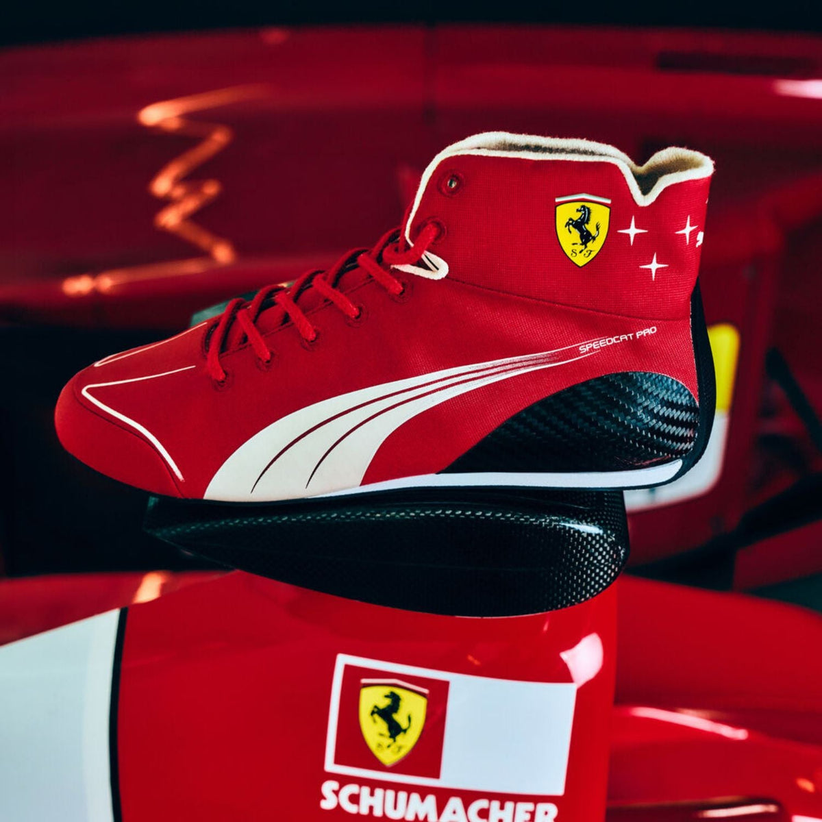 red and white racing shoes for Lewis Hamilton and Charles Leclerc supporters, highlighting the moulded sole and low profile. Race day attire footwear that matches any racing jumpsuit.