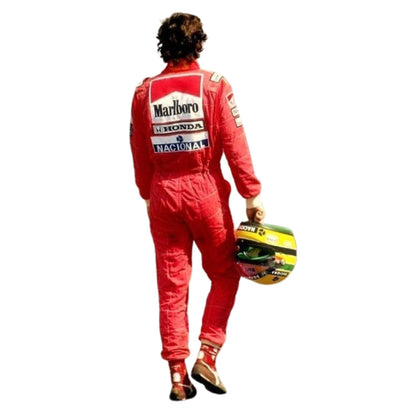 From behind, wearing a red Ayrton Senna 1991 F1 Race Suit McLaren United States GP with visible Marlboro, Honda, and Magnolia sponsor logos, holding a yellow and black racing helmet against a plain white background.
