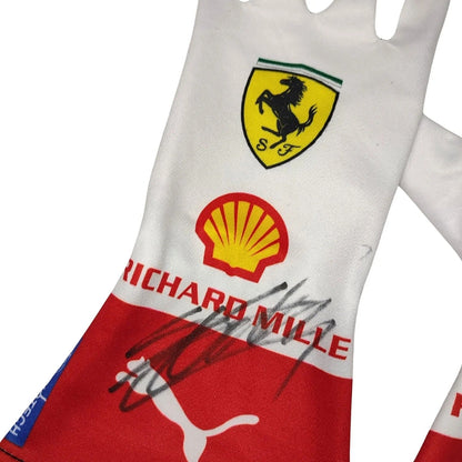 A white and red Ferrari Charles Leclerc 2023 Monaco GP Race Gloves F1 Ferrari with the Scuderia Ferrari shield logo, Shell logo, Richard Mille text, and a black autograph on the front.