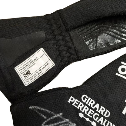 Close-up of a black Fernando Alonso 2024 Race Gloves F1 Aston Martin with Girard-Perregaux branding and OMP label.