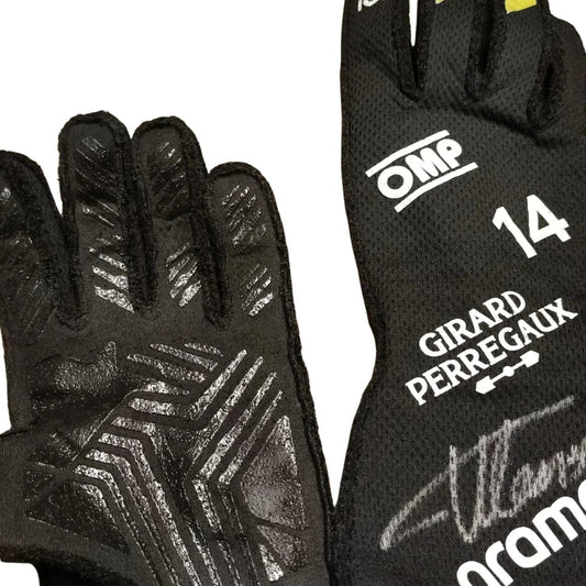 A pair of black Fernando Alonso 2024 Race Gloves F1 Aston Martin shown against a white background, displaying both the textured grip side and the printed side with white text including 'OMP', '14', 'GIRARD PERREGAUX', and a signature.