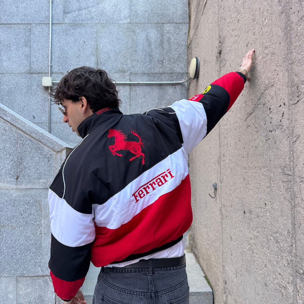 Ferrari vintage racing jacket, with retro livery colours across the body. A head-turning jacket for race weekends and fan gatherings.