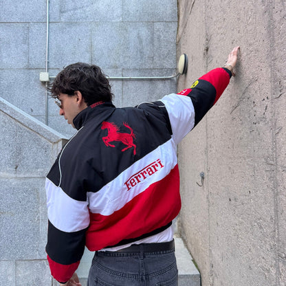 Ferrari vintage racing jacket, with retro livery colours across the body. A head-turning jacket for race weekends and fan gatherings.