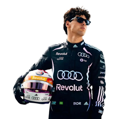 Gabriel Bortoleto wearing a black racing suit with Audi and Revolut logos on a white background close view