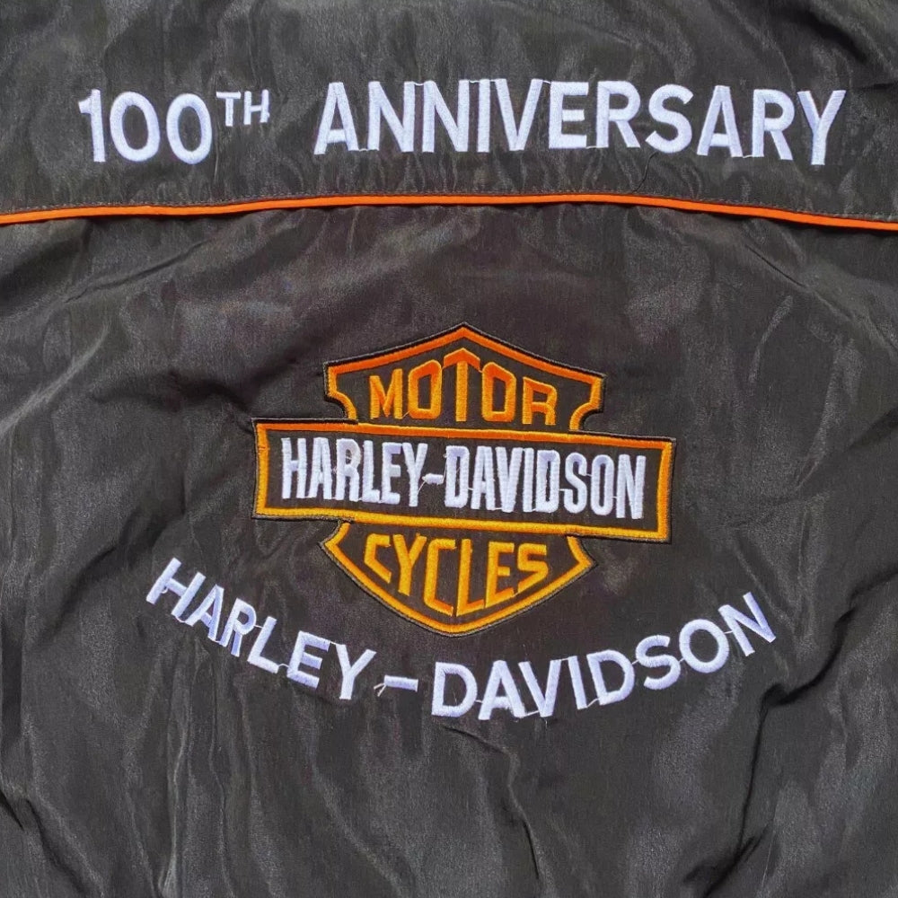 Retro Harley Davidson bomber jacket for fans, showing the embroidered chest badge and ribbed collar. A head-turning jacket for race weekends and fan gatherings.
