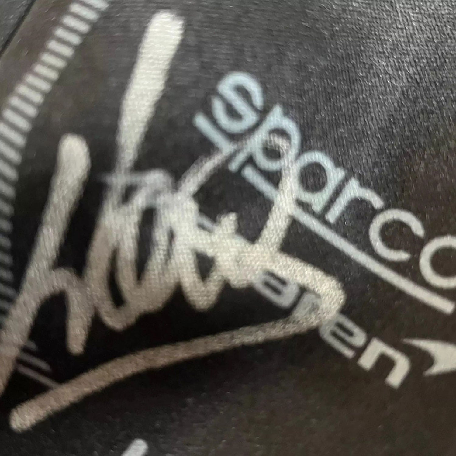 Black Lando Norris Race Gloves F1 in close-up detail, showing the palm grip pattern used in GP racing conditions
