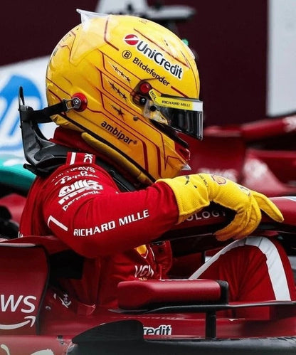 Lewis Hamilton in a red racing suit and yellow helmet with 2025 Yellow Replica Race Gloves F1 Ferrari sitting in a Formula 1 car.