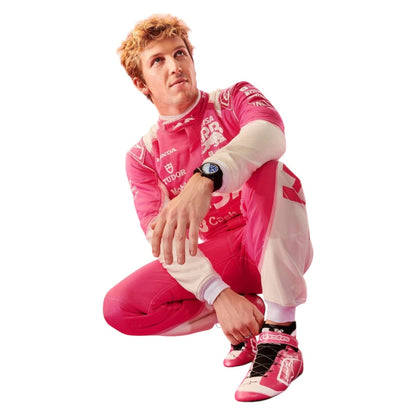 Liam Lawson 2025 F1 Race Suit VCARB Miami GP crouching, wearing pink and white racing shoes with black laces.