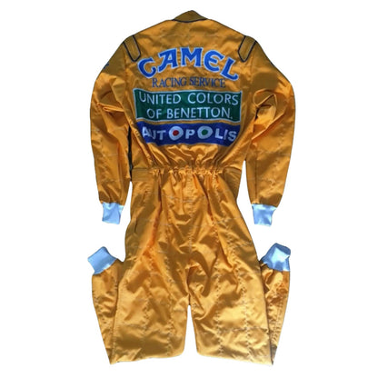 A vintage gold satin Michael Schumacher 1991 F1 Race Replica Costume Benetton Ford shown from the back, featuring blue and green sponsor logos including Camel, United Colors of Benetton, and Metopolis.
