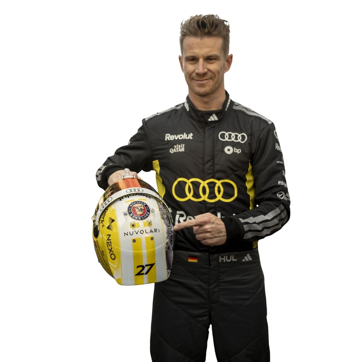 Person in racing suit holding a helmet with visible branding on a white background
