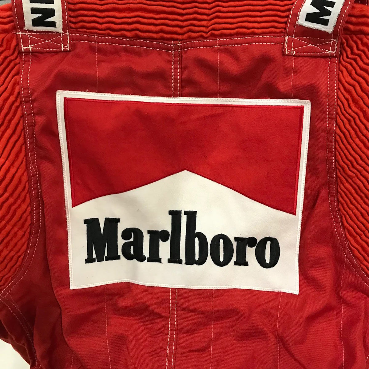 Niki Lauda 1984 F1 Race Costume Replica McLaren World Championship Winning Season Red fabric with a Marlboro logo patch