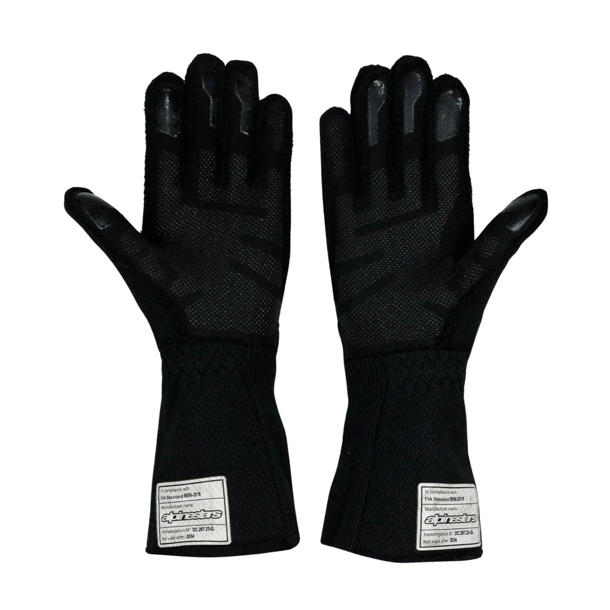 A pair of black Oscar Piastri 2024 Race Gloves F1 McLaren with textured palms and fingertips, featuring white rectangular brand labels near the cuffs, front view