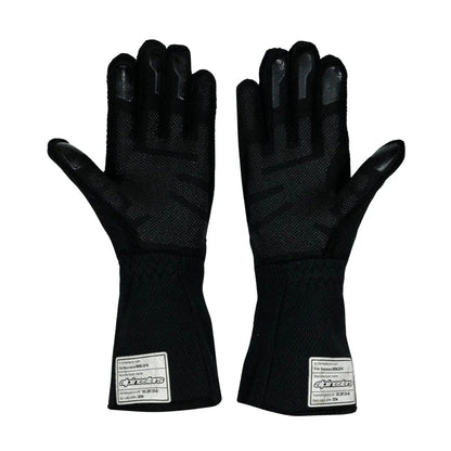 A pair of black Oscar Piastri 2024 Race Gloves F1 McLaren with textured palms and fingertips, featuring white rectangular brand labels near the cuffs, front view