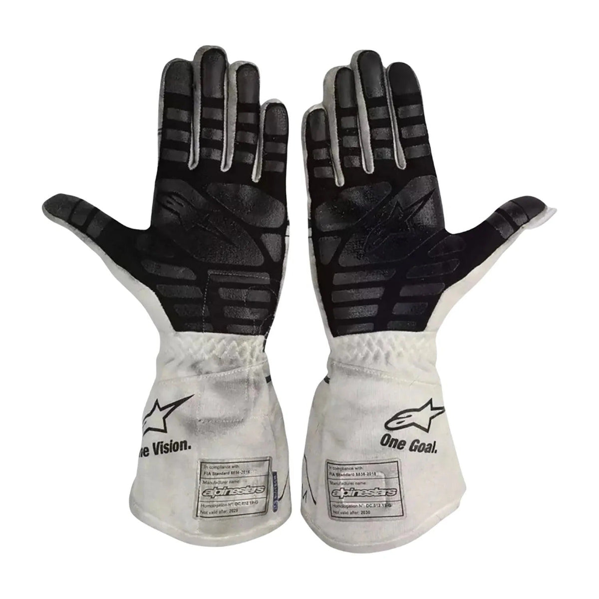 A pair of Alpinestars Pierre Gasly 2020 Race Gloves Replica F1 AlphaTauri shown flat against a white background, displaying the black textured palms and white backs with the Alpinestars logo and 'One Goal' text.