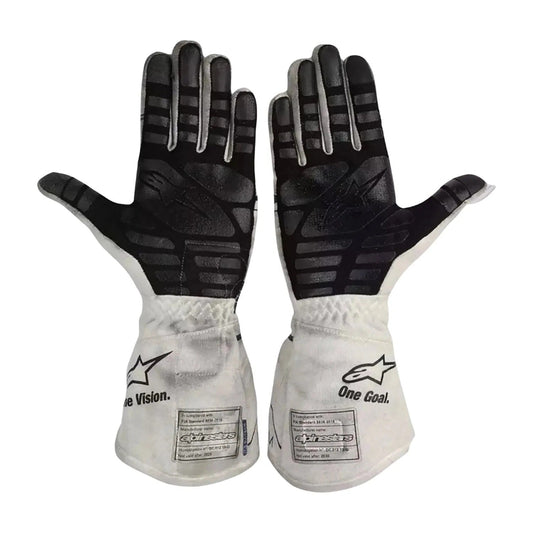 A pair of Alpinestars Pierre Gasly 2020 Race Gloves Replica F1 AlphaTauri shown flat against a white background, displaying the black textured palms and white backs with the Alpinestars logo and 'One Goal' text.