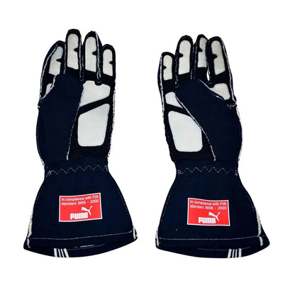A pair of black Sebastian Vettel 2007 Race Gloves F1 Toro Rosso with white protective padding on the palms and fingers, displayed side-by-side against a white background.