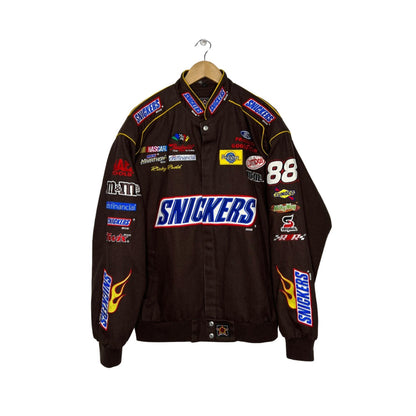 Snickers Retro Racing Bomber Jacket in retro Snickers styling, with retro livery colours across the body. A classic motorsport jacket for fans and collectors alike.