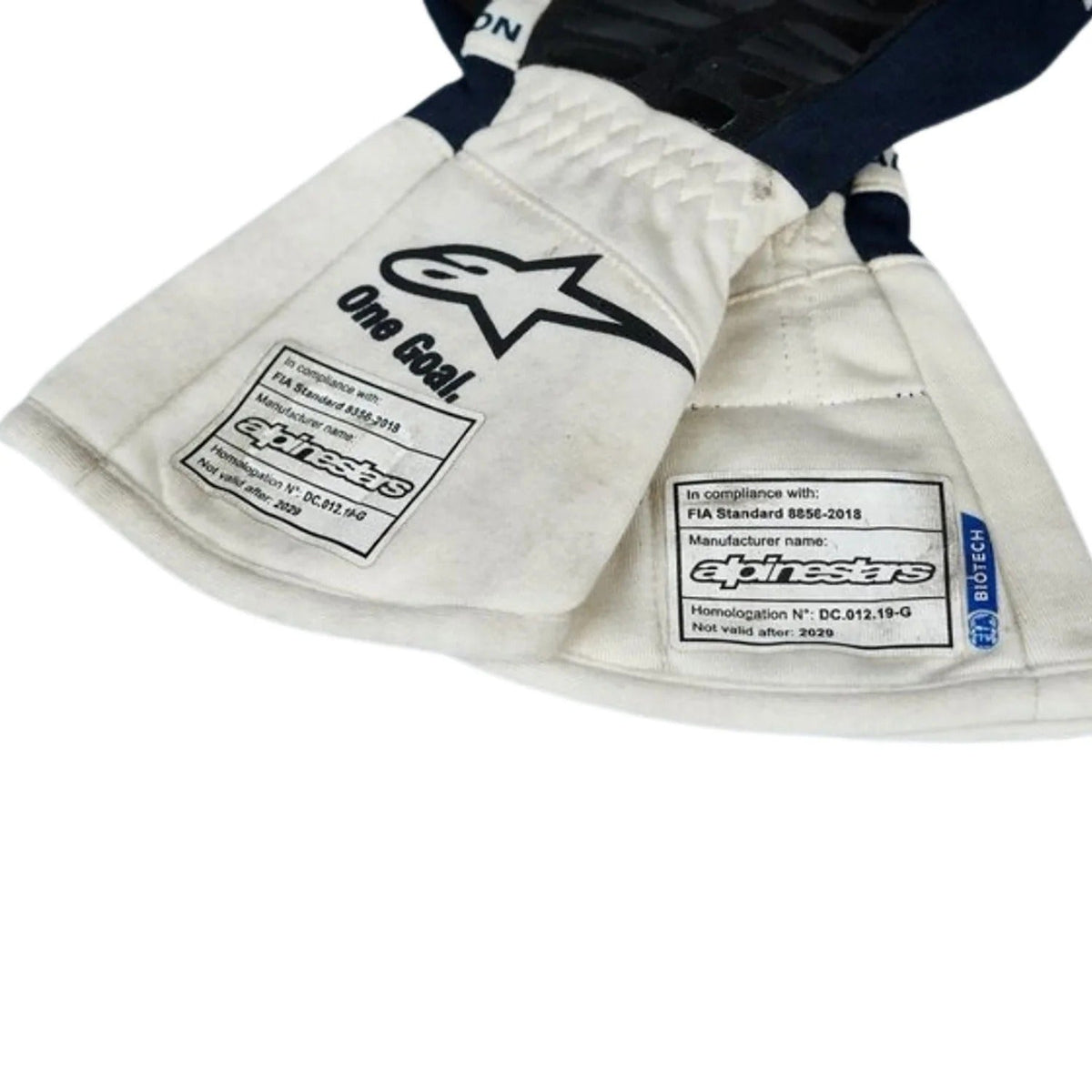 Close-up of a white Yuki Tsunoda 2022 Race Gloves Replica F1 AlphaTauri with visible branding on a white background