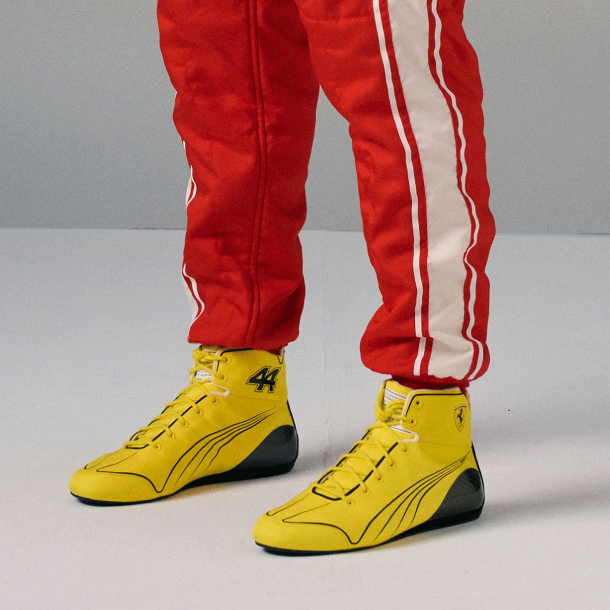 yellow fan footwear from the 2026 British Grand Prix, showing the grippy tread and light build. A neat match for a printed race suit or fan attire.